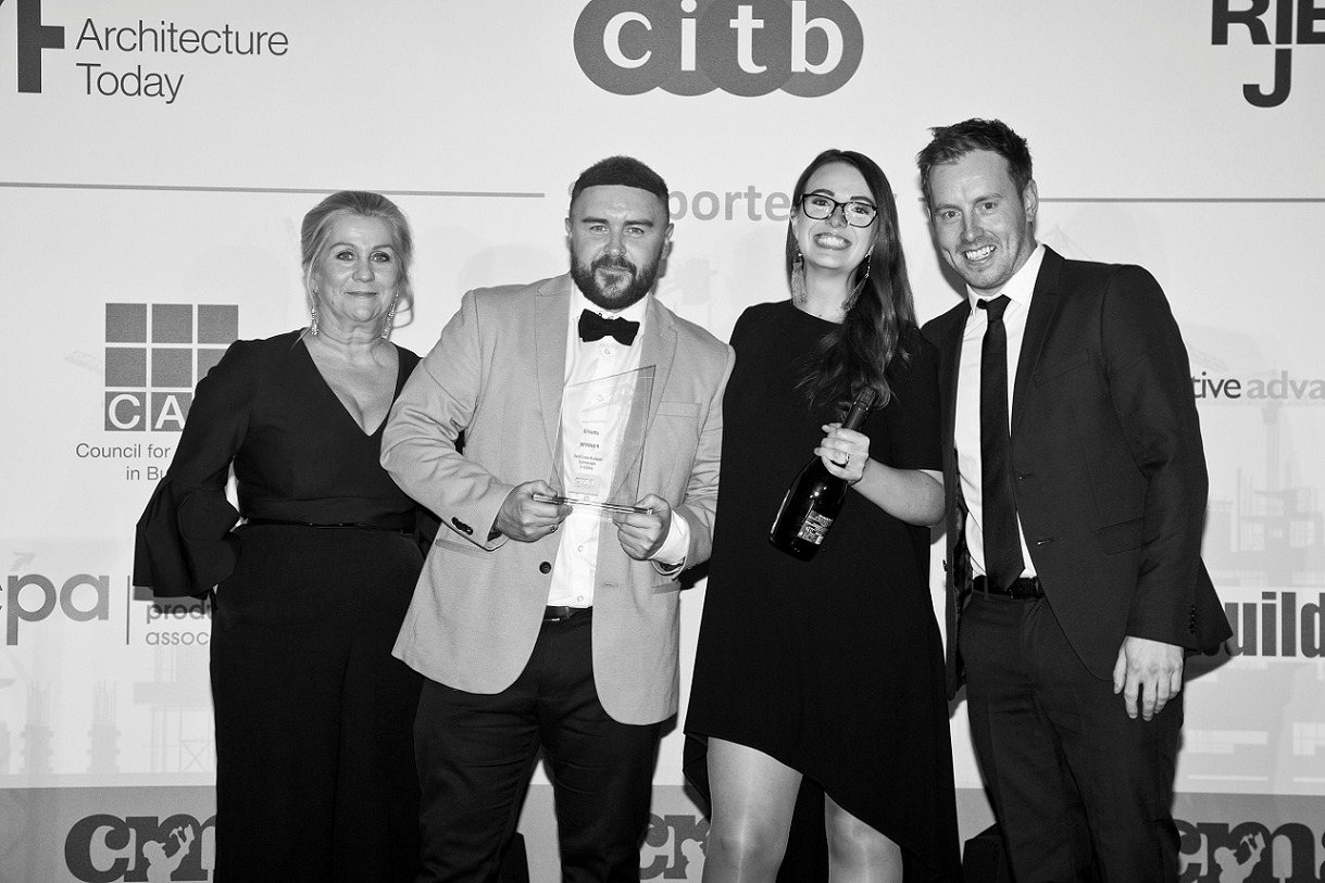 Elliotts’ Graphic Designer, James Harris, and Marketing Executive, Emma McTaggart, collecting the award for Best Marketing Campaign under £25k at the Construction Marketing Awards