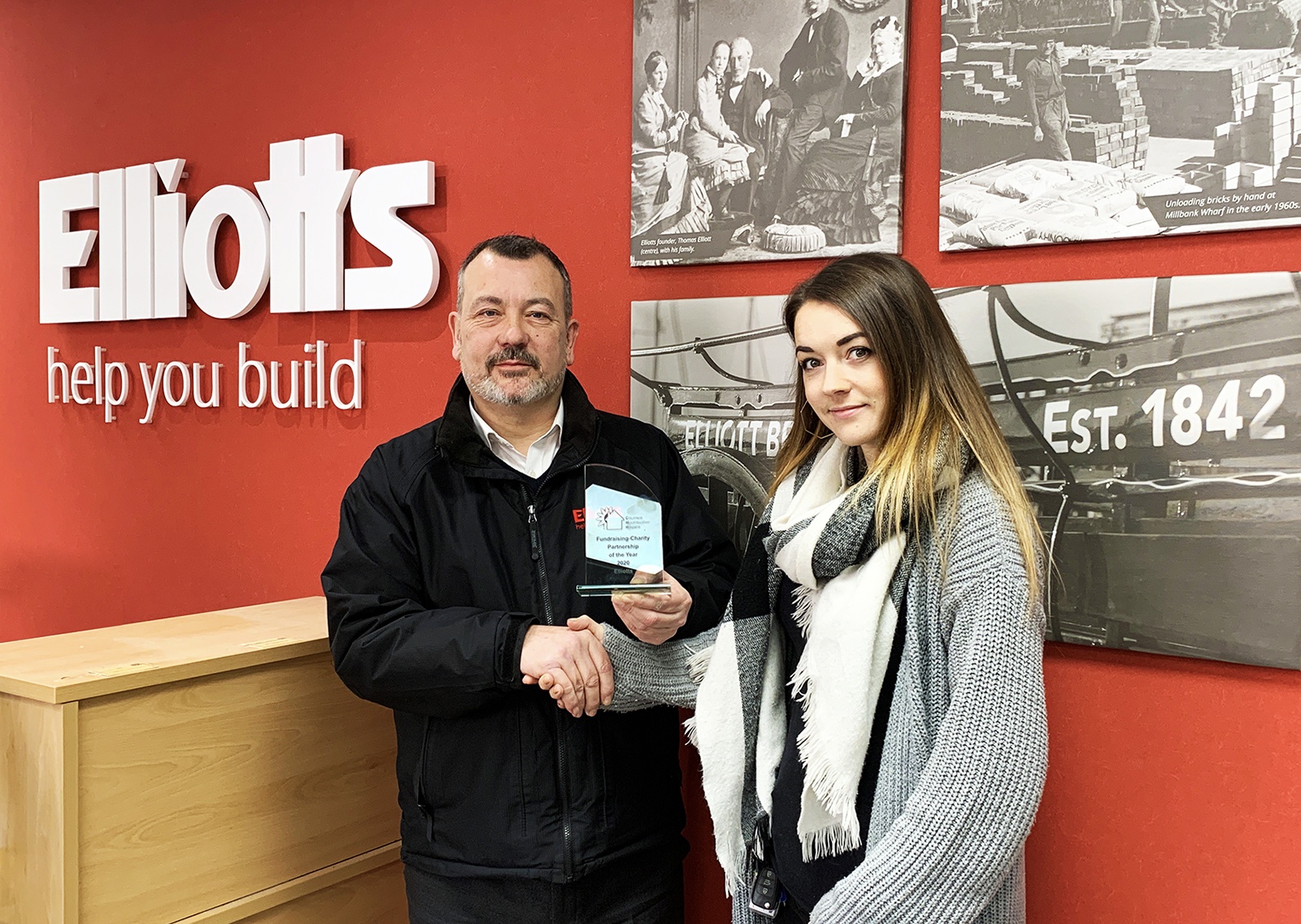 Rachel Rawlings, presents the “Fundraising Charity Partner of the Year” award to Ed Butcher from Elliotts