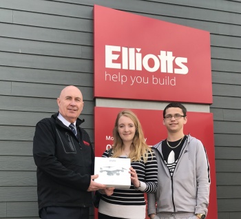 Izzy Schofield receiving her drone from Paul Cleary